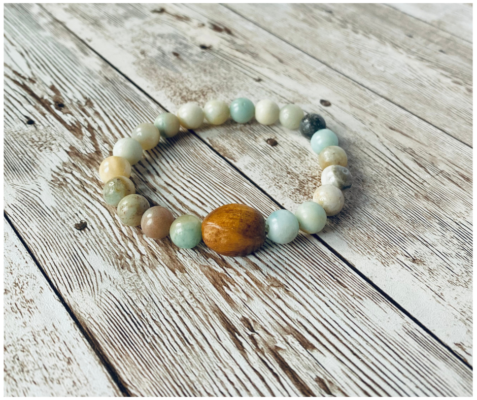 Stretch bracelet with multicolor beads and a larger wood accent bead