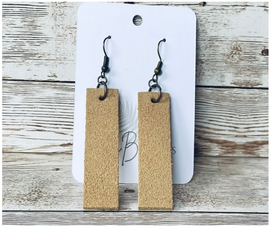 Tan suede long rectangular earring on bronze earring wire.